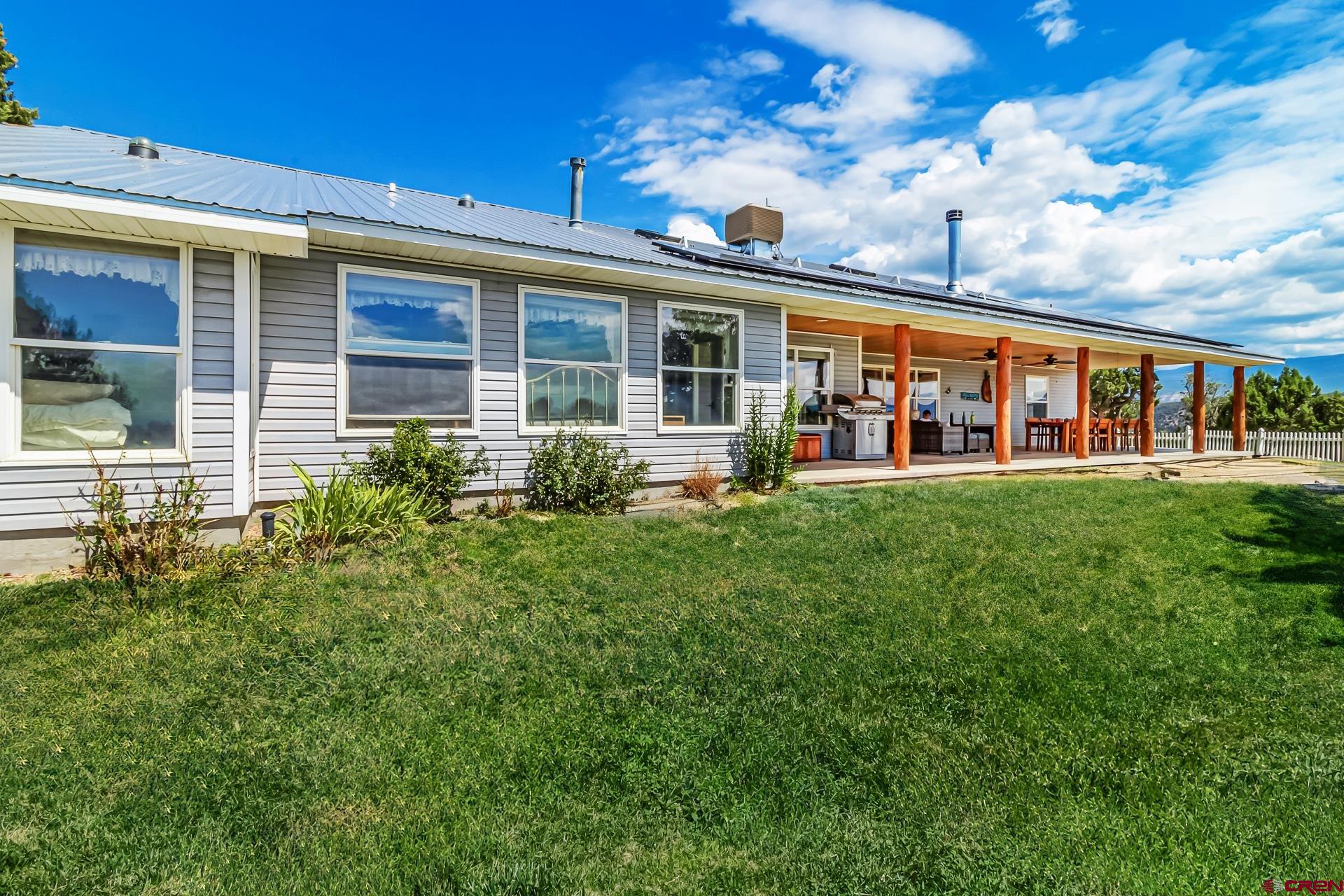 17656 2550th Road Cedaredge, CO 81413 - Photo 36 of 45 front view of a building with a porch