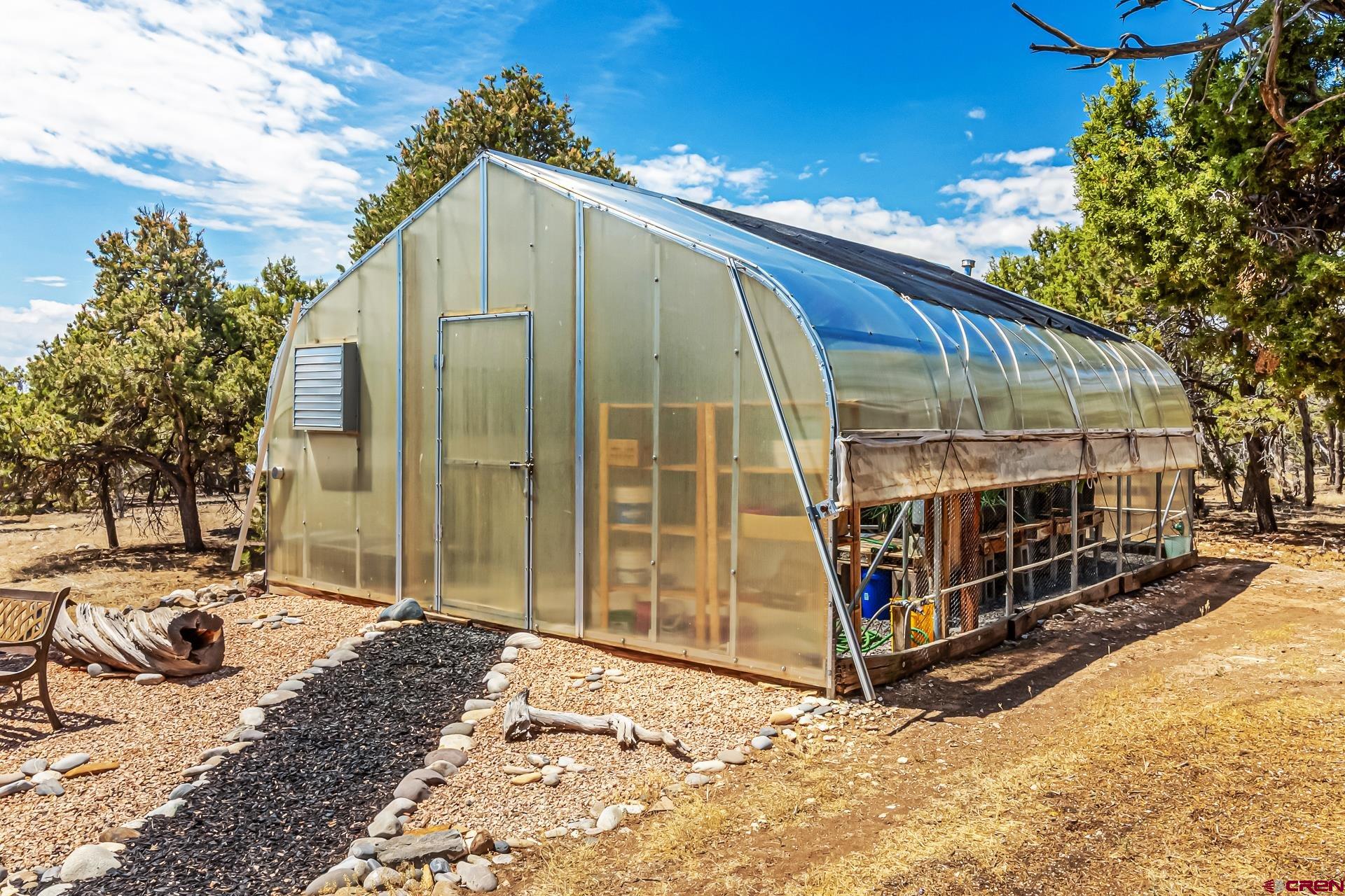 17656 2550th Road Cedaredge, CO 81413 - Photo 37 of 45 a view of a tall building with a yard