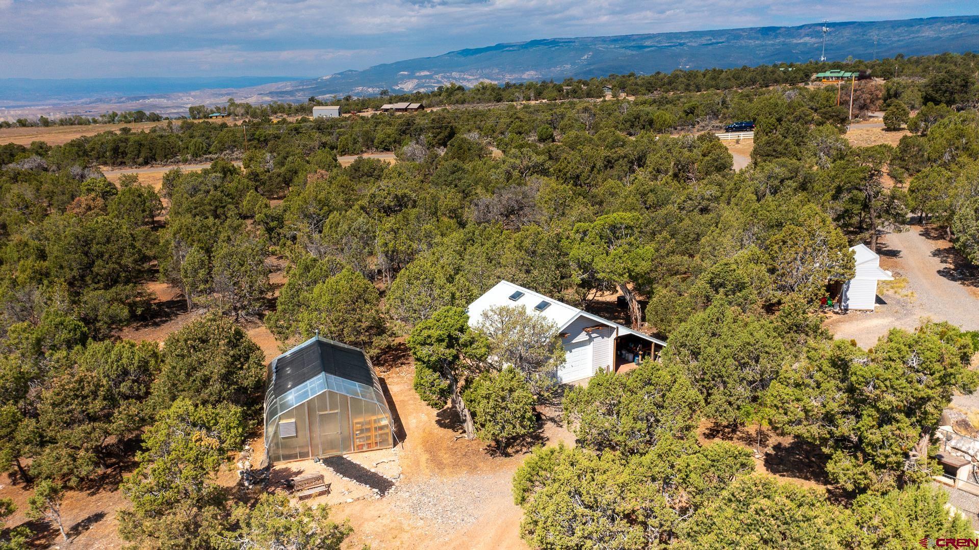 17656 2550th Road Cedaredge, CO 81413 - Photo 45 of 45 an aerial view of a house with a yard