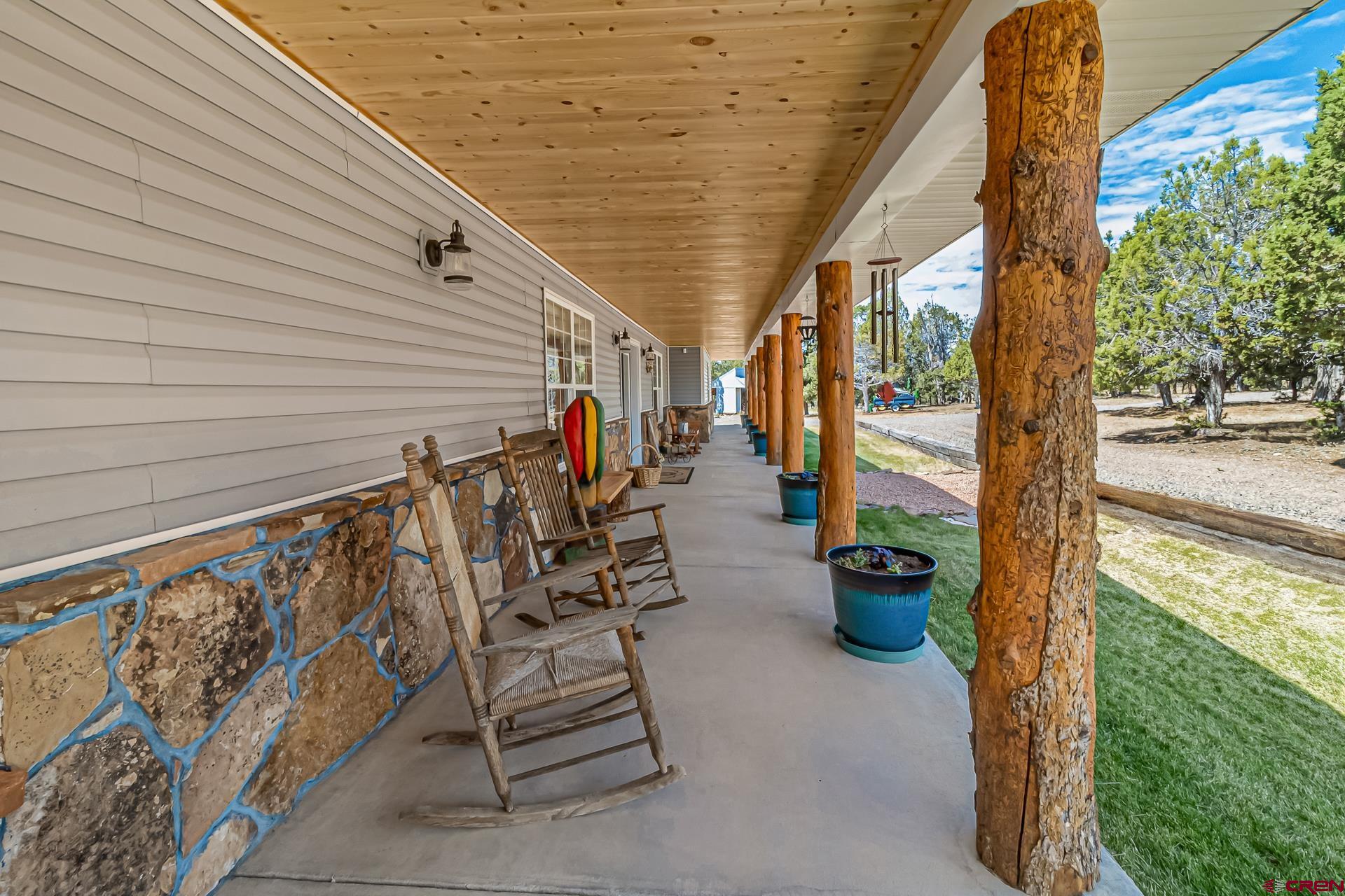 17656 2550th Road Cedaredge, CO 81413 - Photo 5 of 45 a view of a porch with furniture