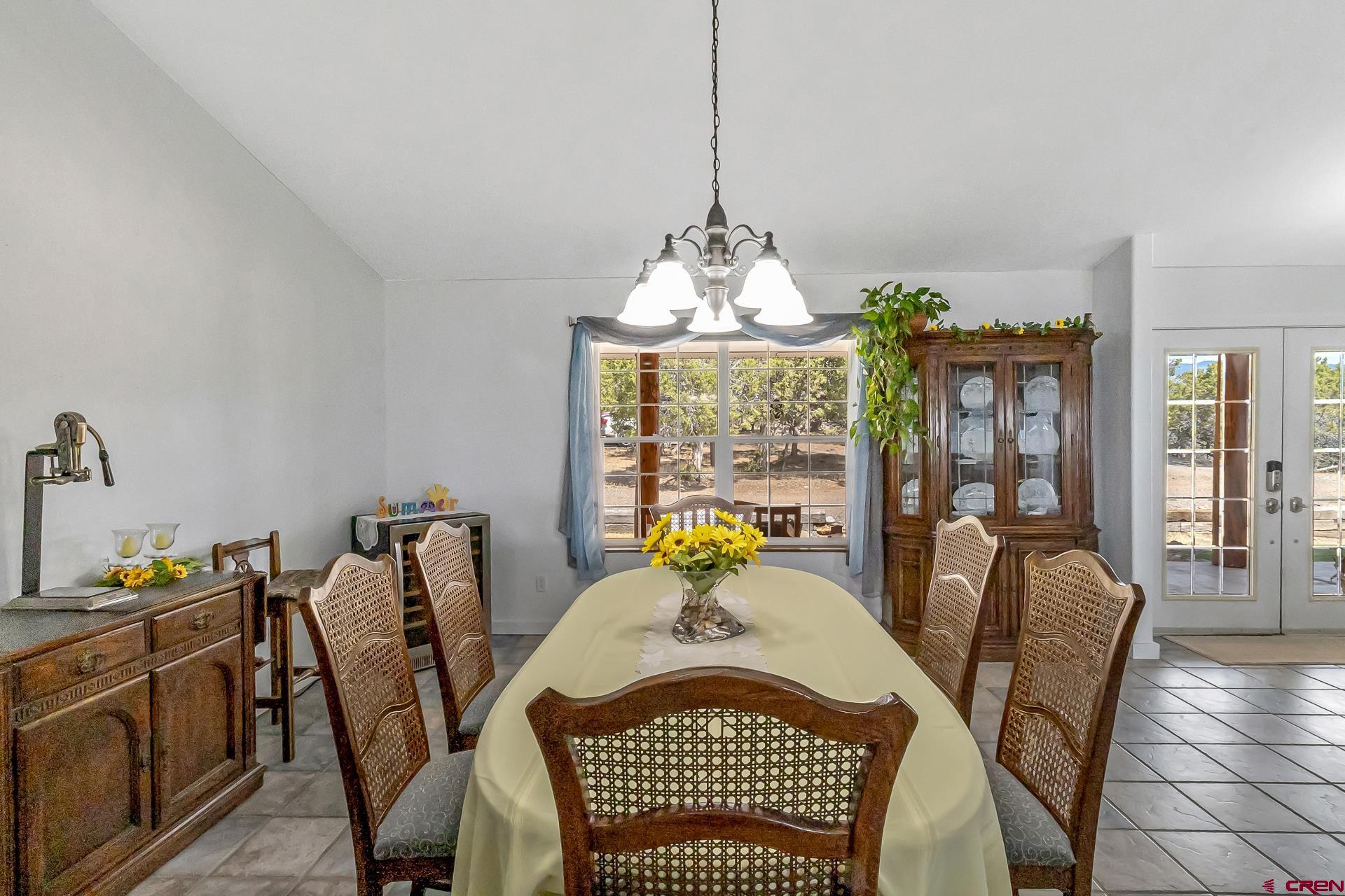 17656 2550th Road Cedaredge, CO 81413 - Photo 8 of 45 a view of a dining room with furniture window and outside view