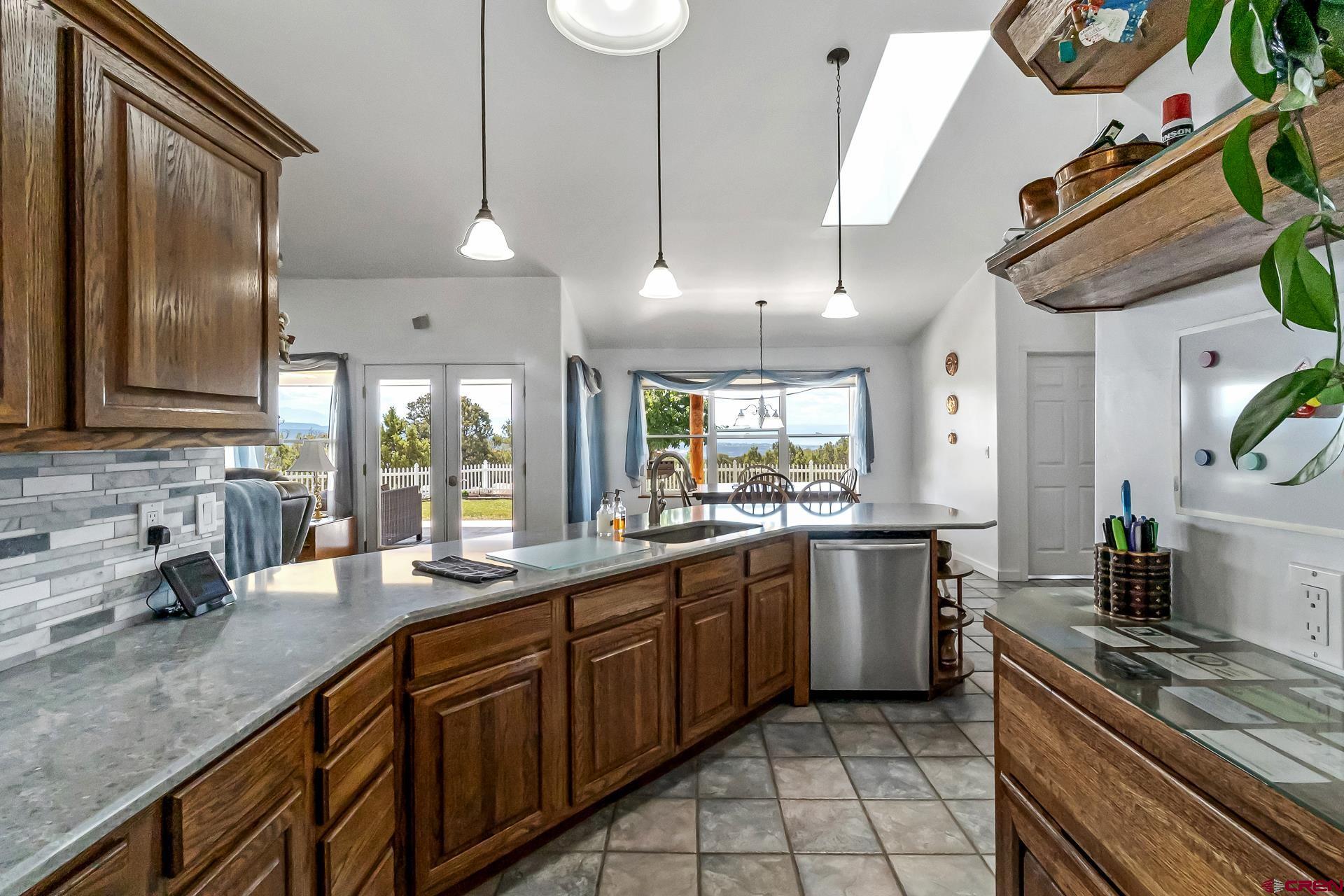 17656 2550th Road Cedaredge, CO 81413 - Photo 10 of 45 a kitchen with lots of counter top space