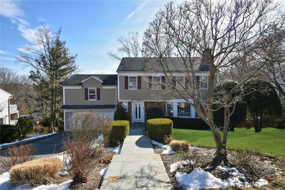 14 Magnolia Road Scarsdale, NY 10583 - Photo 1 of 1 a front view of a house with garden