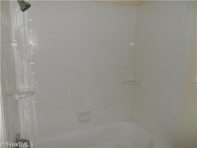 4995 Pine Hall Road Walkertown, NC 27051 - Photo 12 of 16 Bath. This full bath has a new tub with new wall tile and floor tile