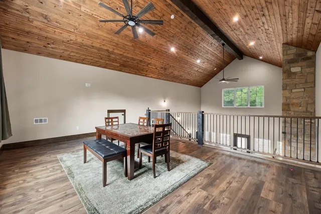 a workspace with furniture wooden floor and window