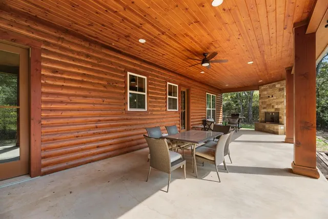 a patio with table and chairs