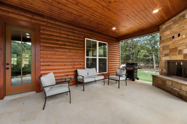 a view of a livingroom with furniture and a fireplace