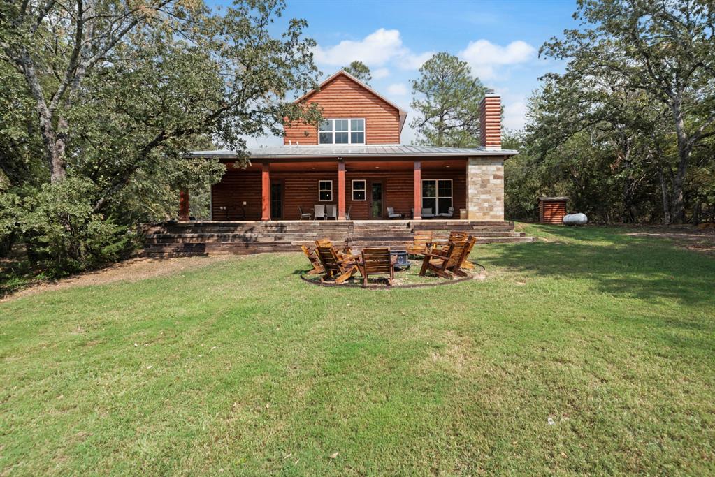 483 Spout Springs Road Pottsboro, TX 75076 - Photo 33 of 35 a front view of house with outdoor seating yard and green space