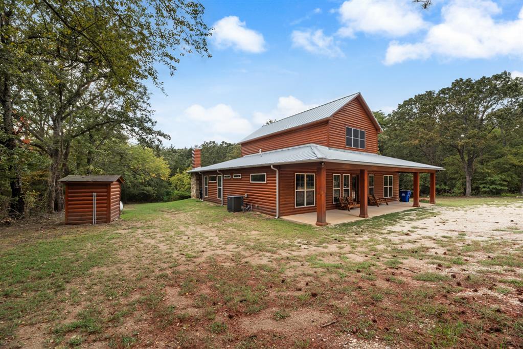 483 Spout Springs Road Pottsboro, TX 75076 - Photo 35 of 35 a view of a house with a yard