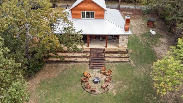 a view of a small house with roof deck