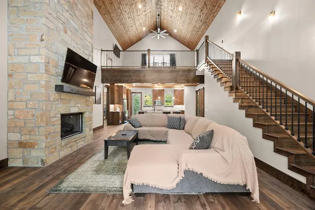 a living room with furniture fireplace and flat screen tv