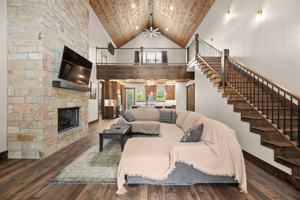 483 Spout Springs Road Pottsboro, TX 75076 - Photo 5 of 35 a living room with furniture fireplace and flat screen tv