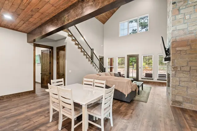 a dinning area with furniture and wooden floor