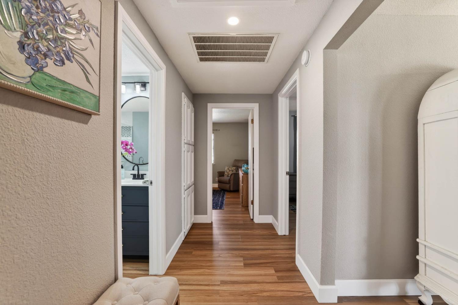 11875 Arno Road Wilton, CA 95693 - Photo 21 of 65 a view of a hallway with wooden floor and staircase