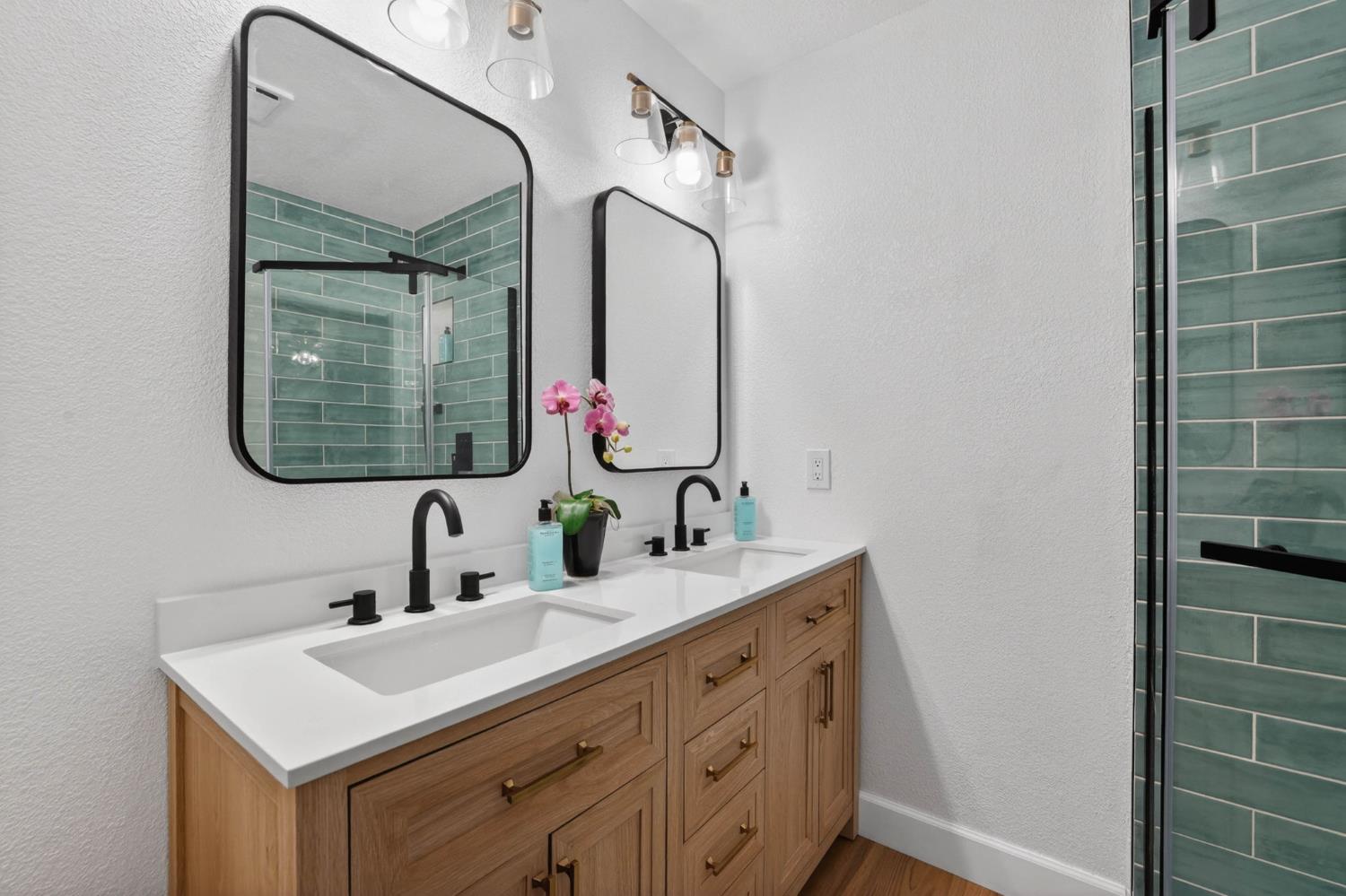 11875 Arno Road Wilton, CA 95693 - Photo 32 of 65 a bathroom with a sink vanity and a mirror
