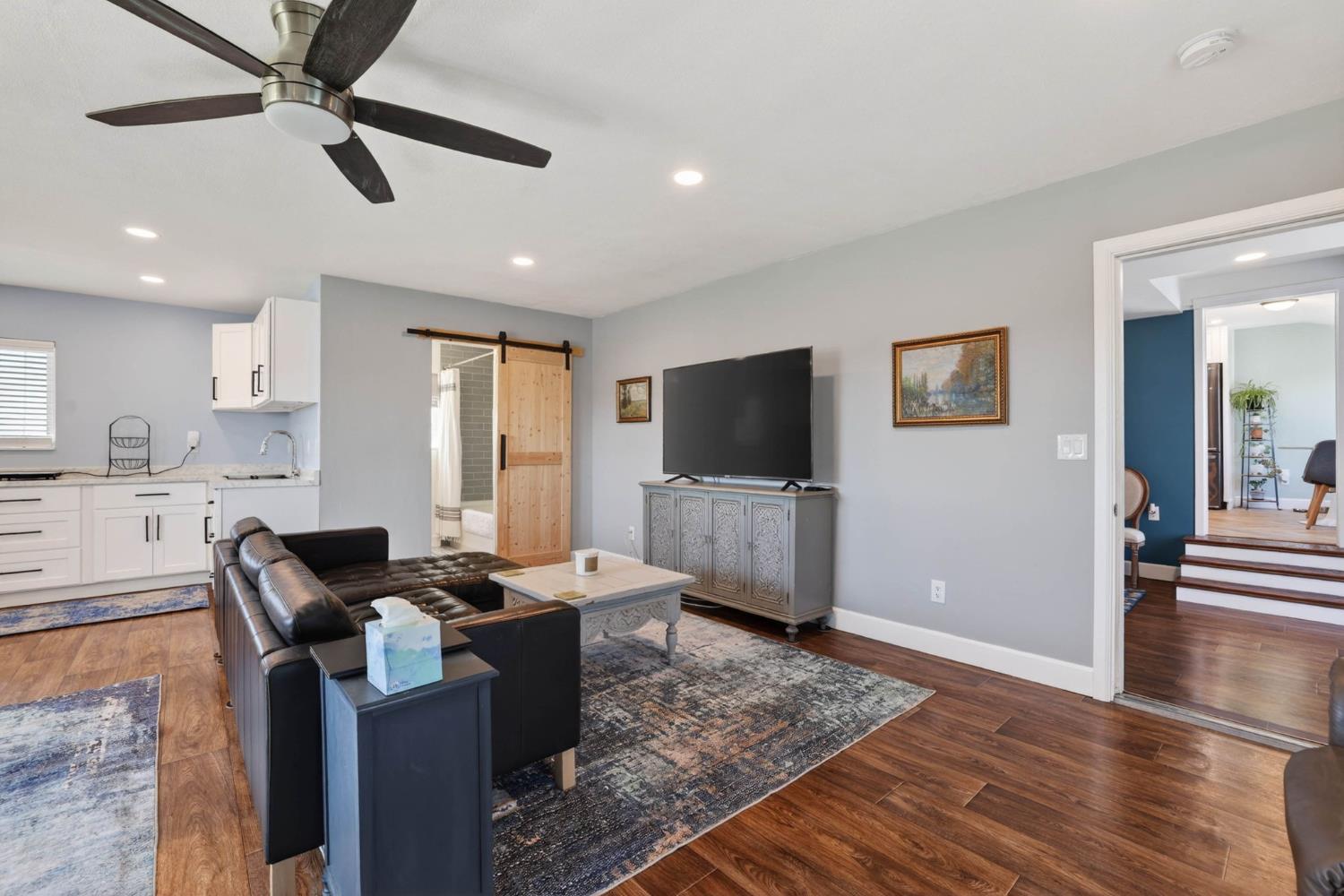 11875 Arno Road Wilton, CA 95693 - Photo 43 of 65 a living room with furniture and a flat screen tv