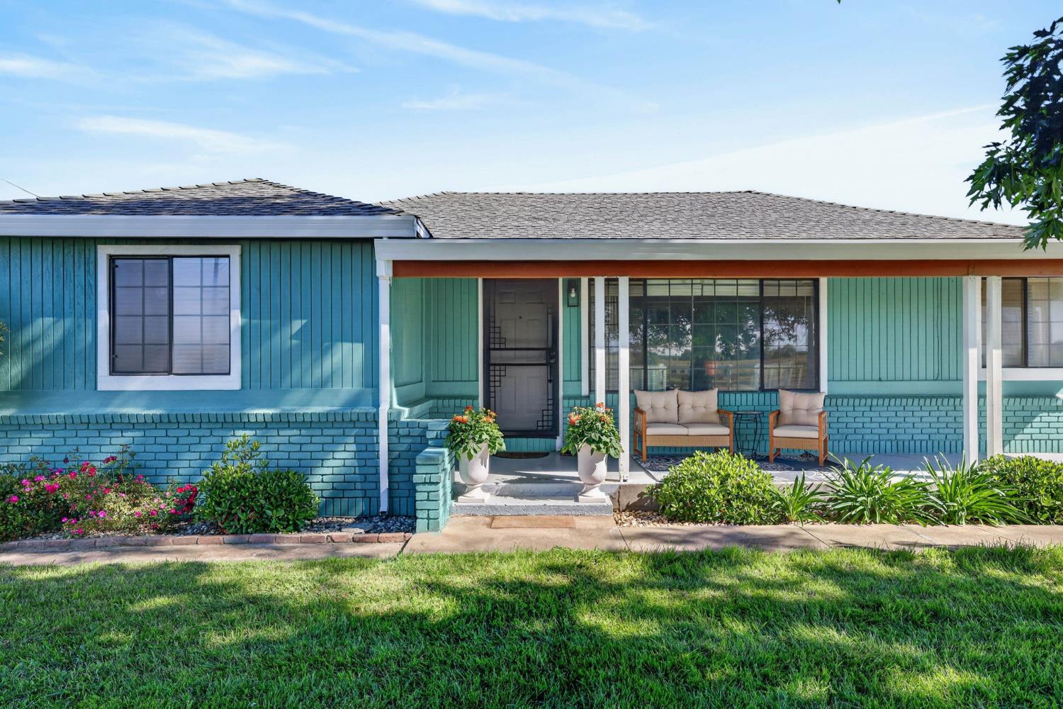 11875 Arno Road Wilton, CA 95693 - Photo 5 of 65 front view of a house with a garden
