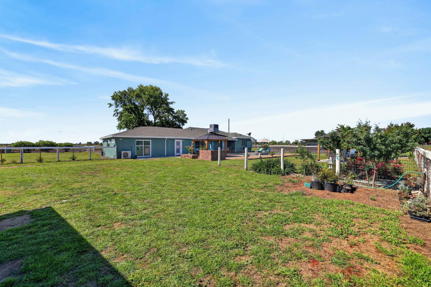 11875 Arno Road Wilton, CA 95693 - Photo 52 of 65 a view of a house with a big yard