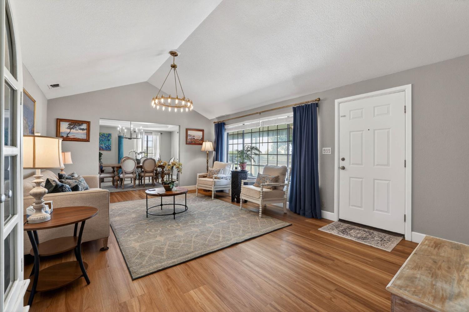 11875 Arno Road Wilton, CA 95693 - Photo 7 of 65 a living room with furniture and a chandelier