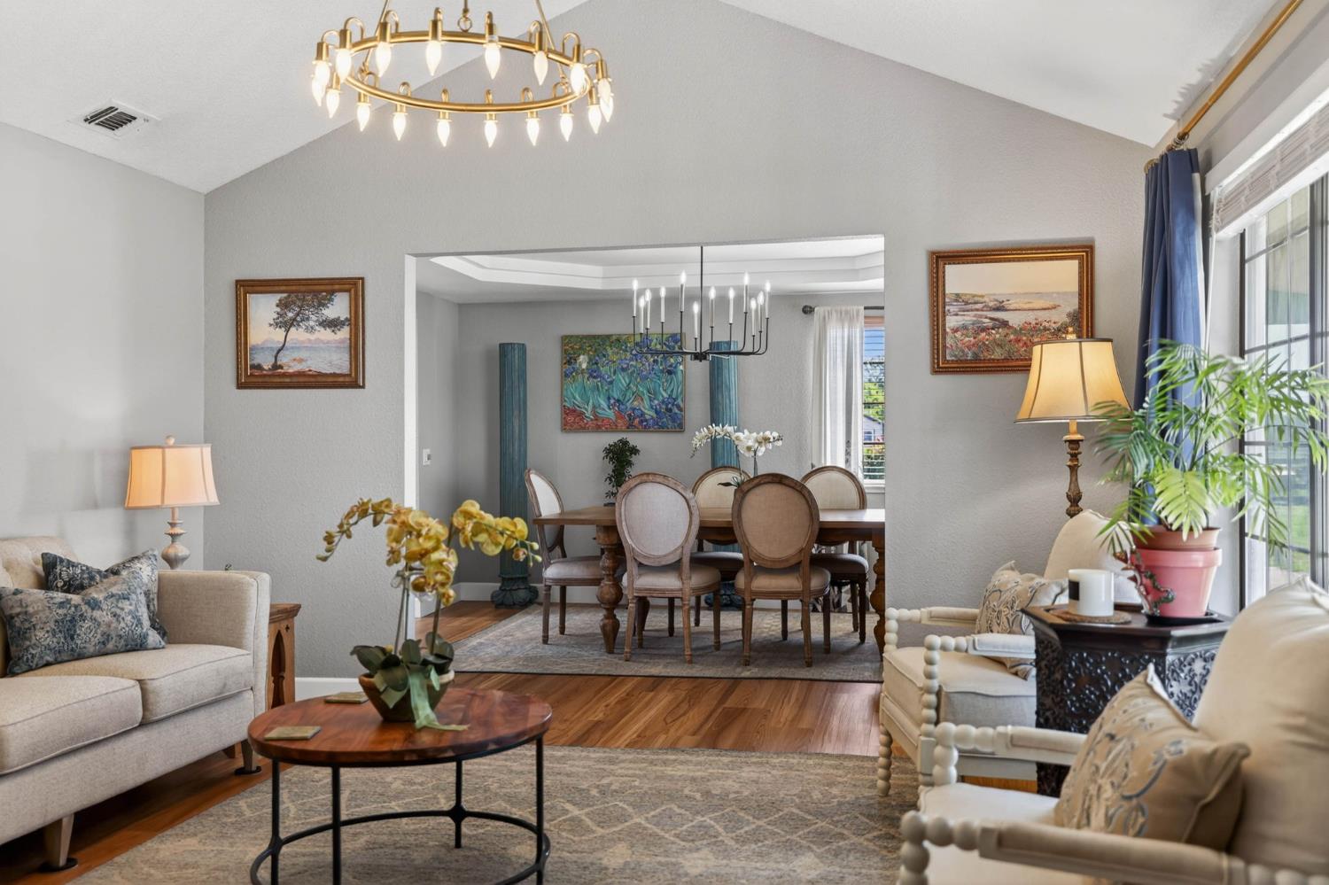 11875 Arno Road Wilton, CA 95693 - Photo 10 of 65 a living room with furniture and a chandelier