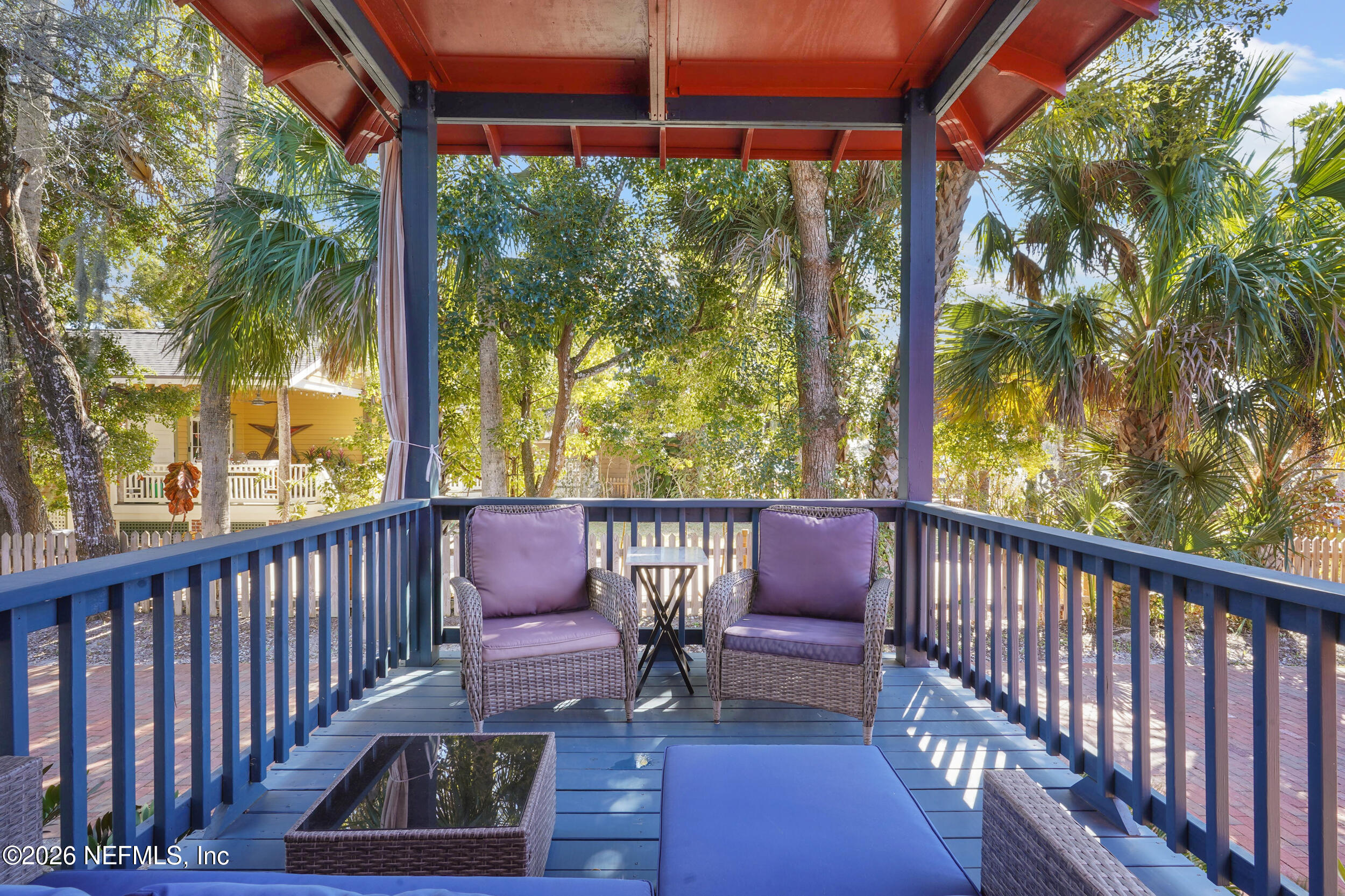 290 St George Street, Unit B St. Augustine, FL 32084 - Photo 18 of 19 a view of a chair and table in the balcony