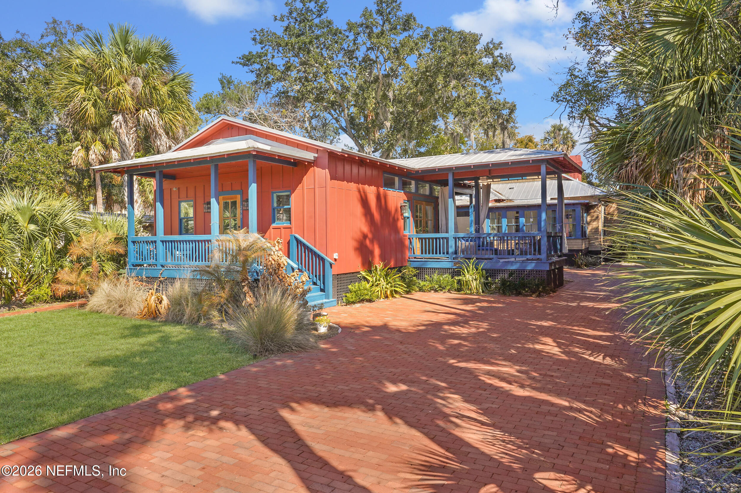 290 St George Street, Unit B St. Augustine, FL 32084 - Photo 2 of 19 a front view of a house with garden