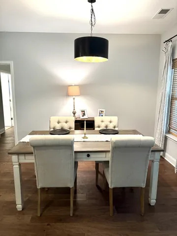 a kitchen with a table and chairs