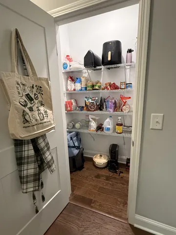 a kitchen view of a fireplace and lots of clutter