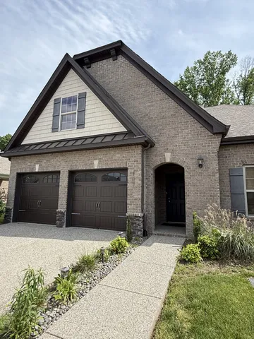 a front view of a house with a garage