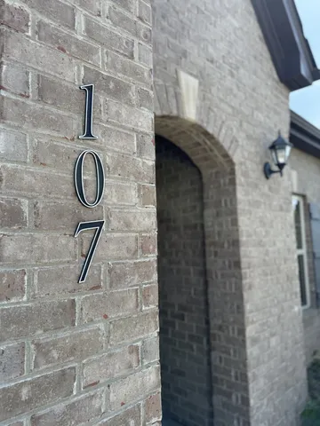 a bathroom with a shower and a sink