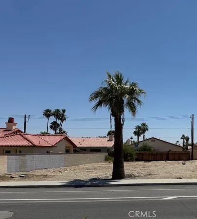 a view of a house with a yard and garage