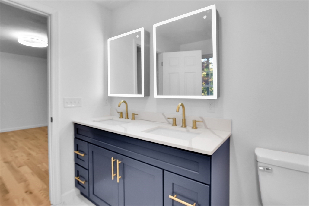 76 Number 6 Schoolhouse Road Charlton, MA 01507 - Photo 14 of 29 a bathroom with a sink and a mirror