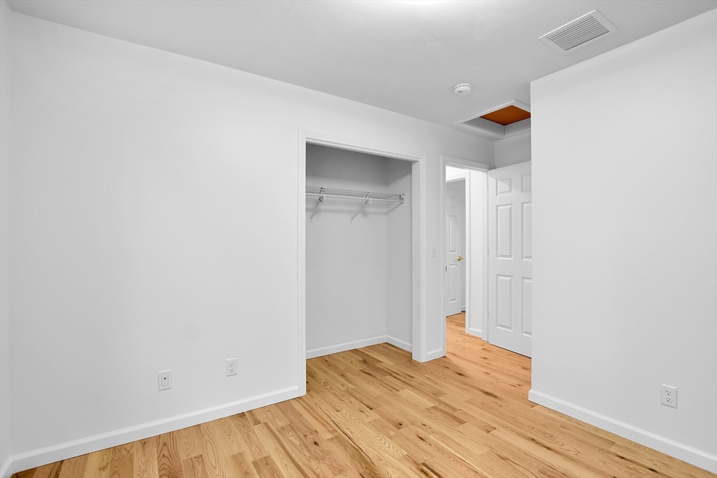 76 Number 6 Schoolhouse Road Charlton, MA 01507 - Photo 16 of 29 a view of empty room with wooden floor