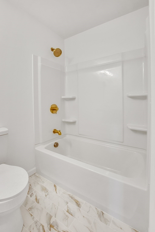 76 Number 6 Schoolhouse Road Charlton, MA 01507 - Photo 17 of 29 a bathroom with a bathtub and a toilet