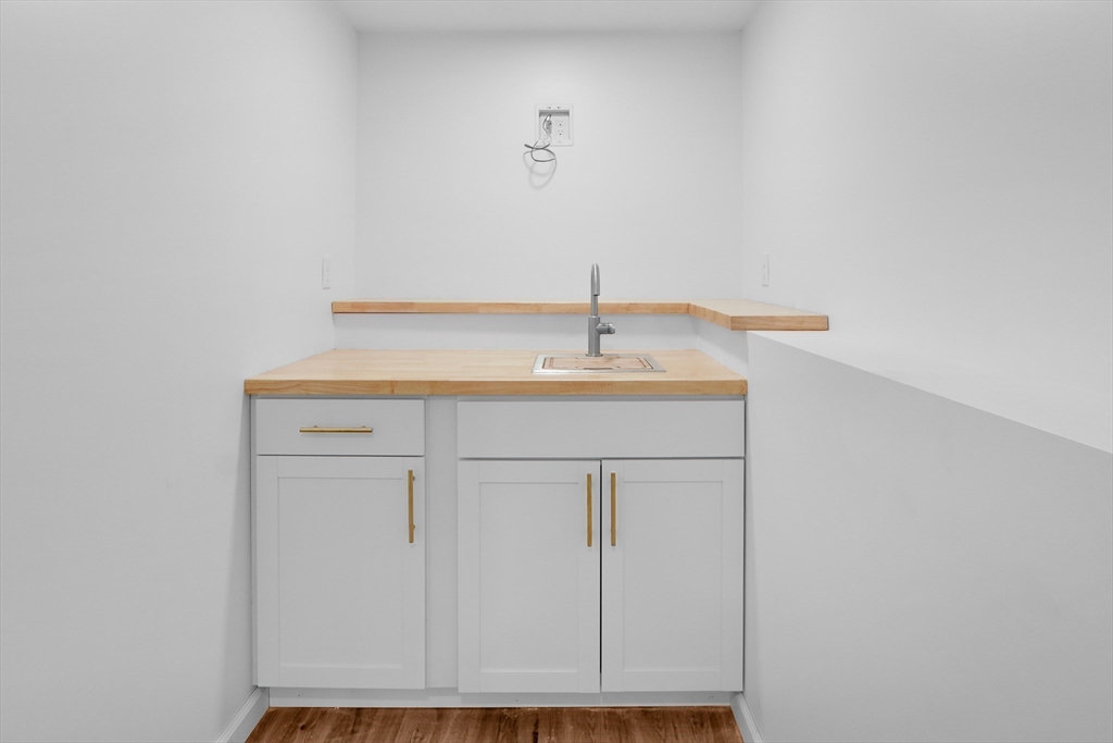 76 Number 6 Schoolhouse Road Charlton, MA 01507 - Photo 19 of 29 a bathroom with a sink and a mirror