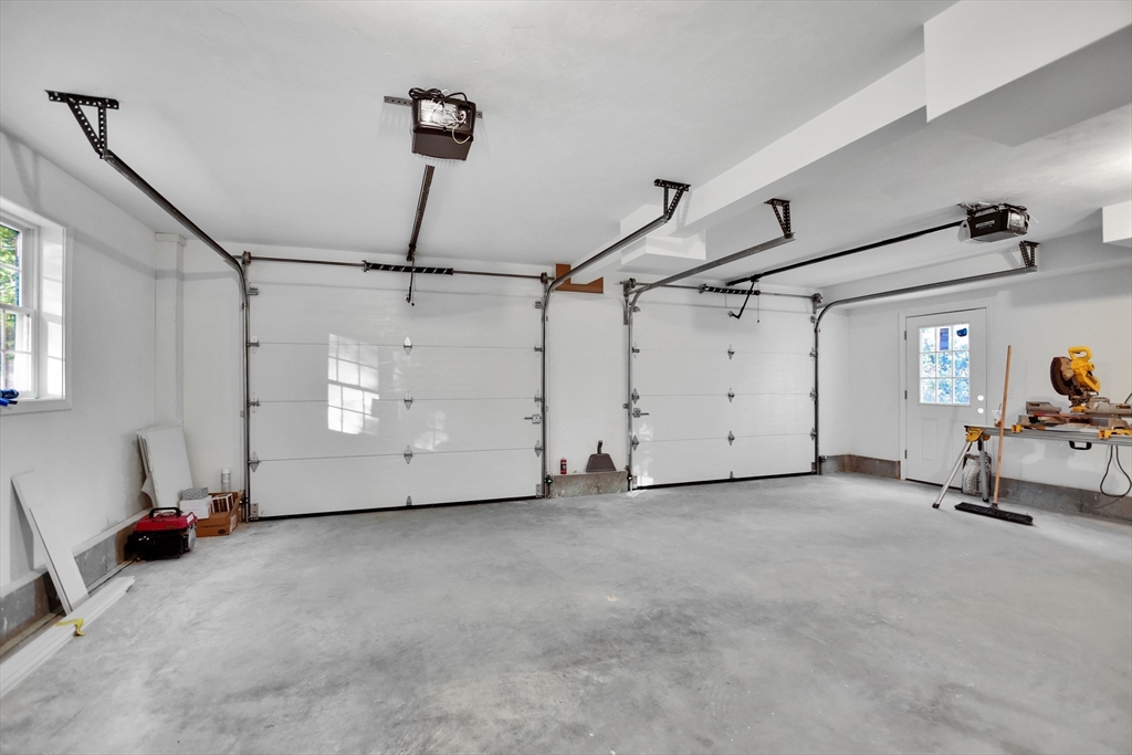 76 Number 6 Schoolhouse Road Charlton, MA 01507 - Photo 24 of 29 a view of a room with gym equipment and windows