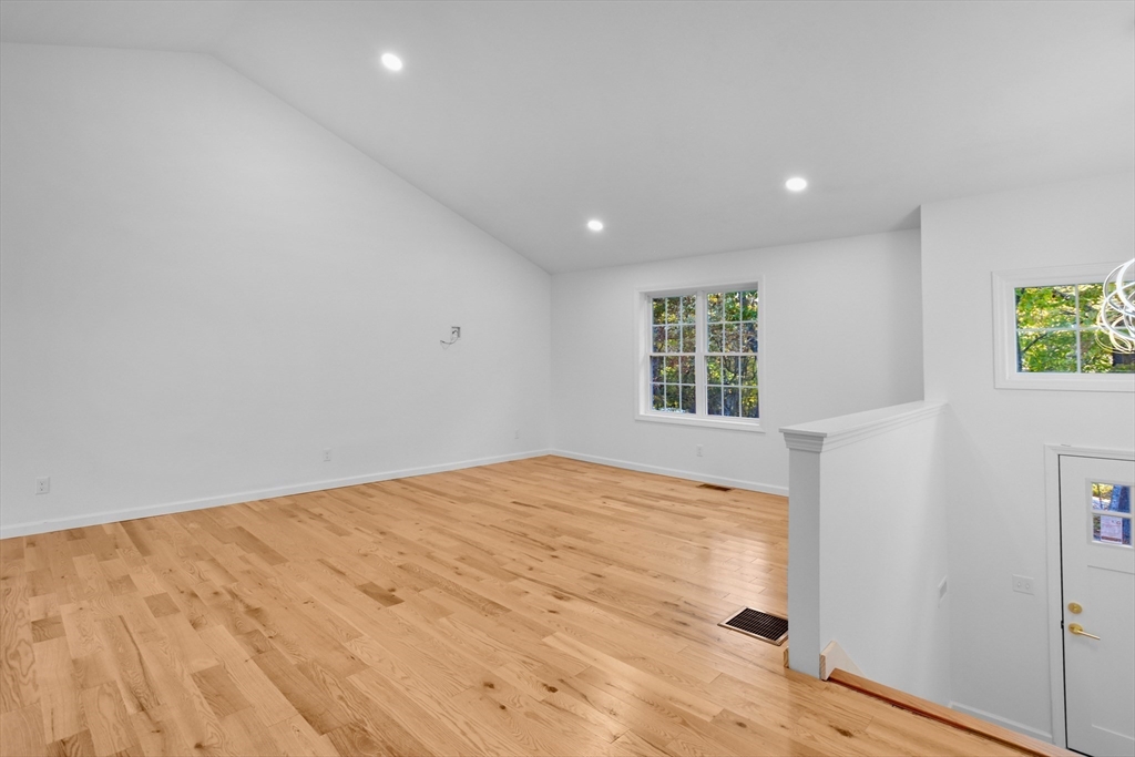 76 Number 6 Schoolhouse Road Charlton, MA 01507 - Photo 6 of 29 a view of an empty room and window