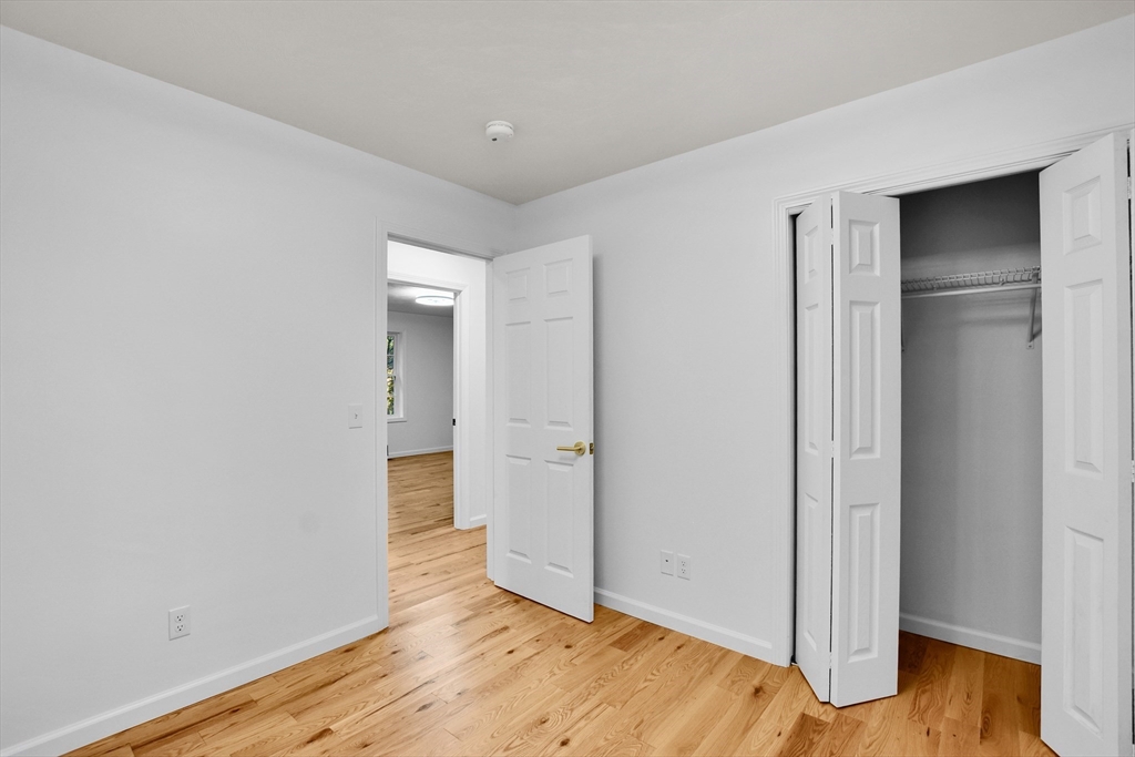 76 Number 6 Schoolhouse Road Charlton, MA 01507 - Photo 7 of 29 a view of empty room with wooden floor