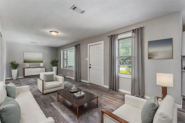 a living room with furniture and a table