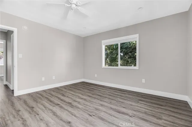 a view of hallway with wooden floor