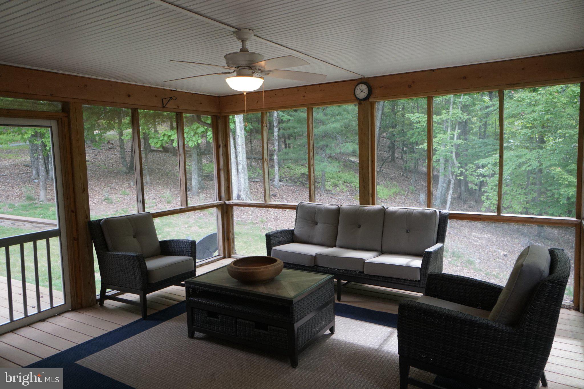 150 Sharp Ridge Lane Franklin, WV 26807 - Photo 56 of 69 Serene screened porch with nature views.