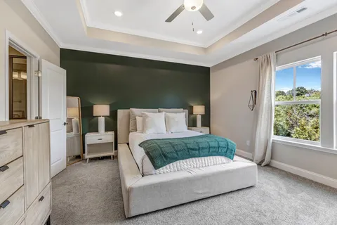 a bedroom with a bed and a dresser