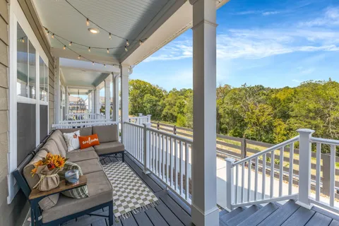 a view of a brick house with large windows