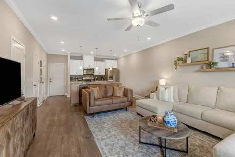 a kitchen with stainless steel appliances granite countertop a sink a stove a microwave and refrigerator