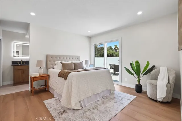 a bedroom with a bed and a couch