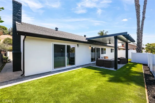 a view of a house with swimming pool and porch