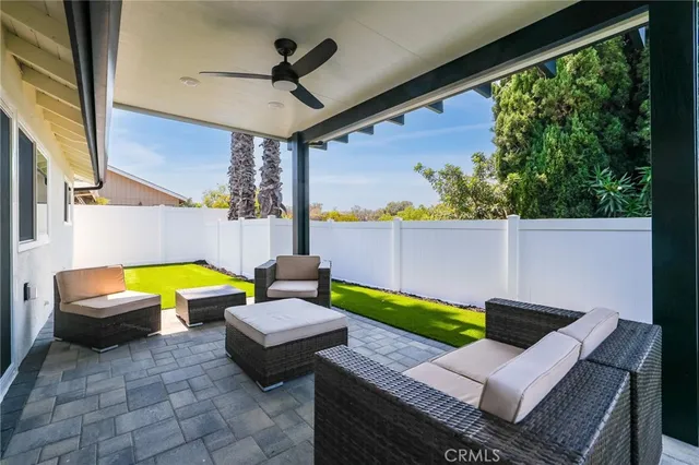 a view of swimming pool with a lounge chairs