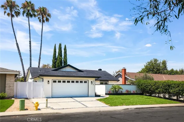 a view of front of house with a yard