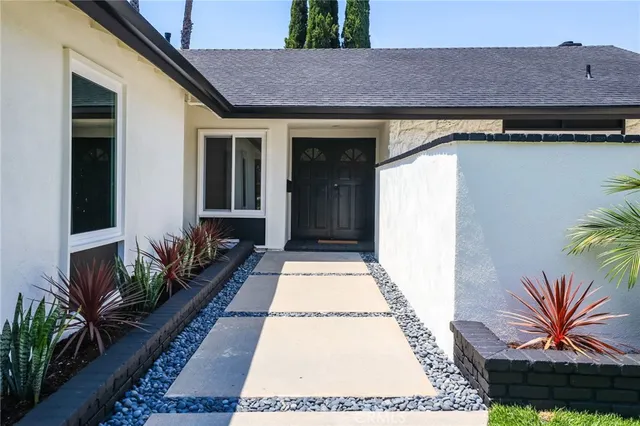 a house view with a garden space