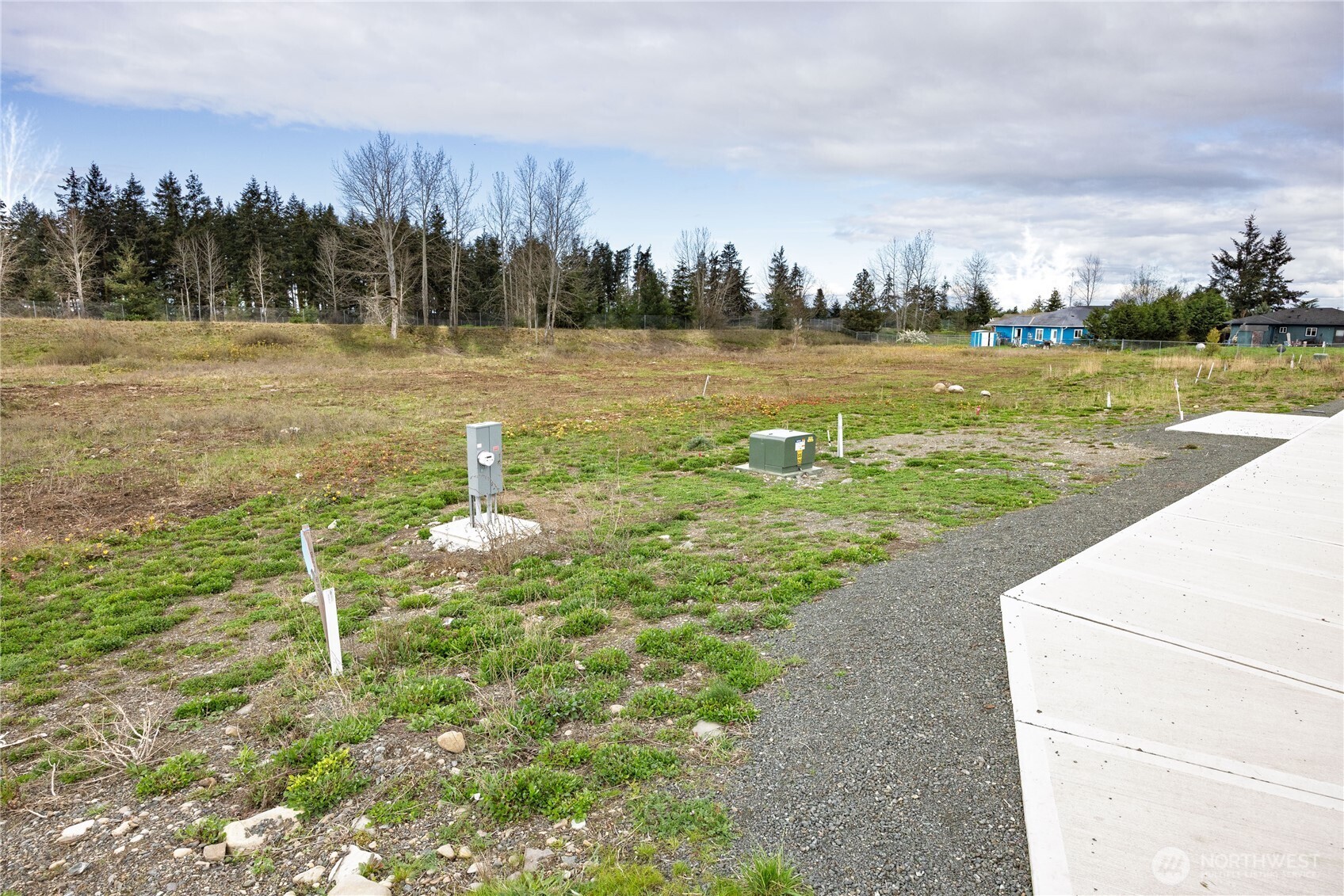 660 McCurdy Road Sequim, WA 98382 - Photo 4 of 22 a view of a lake with houses in back